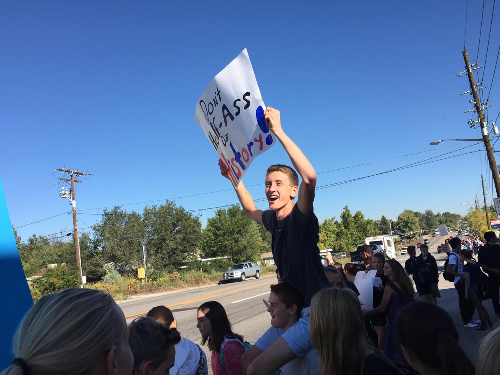 Hundreds of Lakewood High School students, including this one, left their classrooms in September to protest a proposed history curriculum they believed would lead to censorship. Students organized the walkouts using social media sites like Facebook. Photo by Nic Garcia/Chalkbeat Colorado 